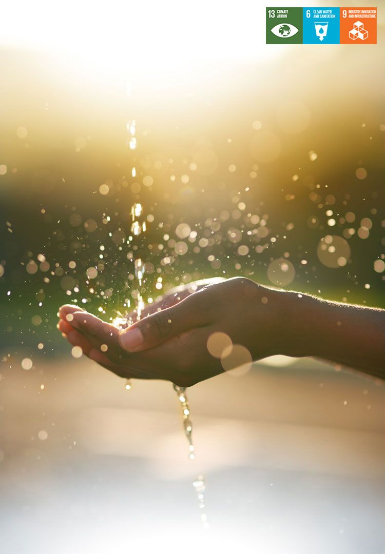 Closeup shot of hands held out under a stream of water